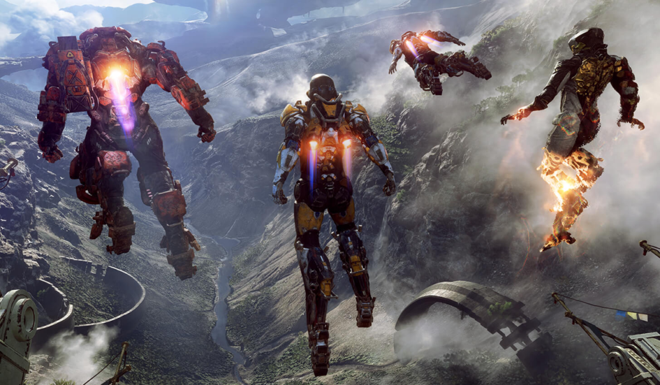 An image of four suits from the game Anthem, hovering in front of a majestic landscape.